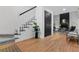 Inviting foyer with hardwood floors, staircase, and a view of the living room with a fireplace at 3385 Wayland Dr, Ladson, SC 29456