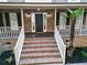 Welcoming front porch with brick stairs, white railings, and a classic black front door at 3385 Wayland Dr, Ladson, SC 29456