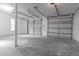 Spacious garage with concrete floors and two large doors provides ample parking and storage at 3385 Wayland Dr, Ladson, SC 29456