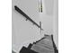 Bright staircase featuring white walls, dark treads, a carpet runner and a dark handrail at 3385 Wayland Dr, Ladson, SC 29456
