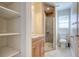 Bathroom featuring shower with glass door and wood vanity with storage at 3627 Marginal Rd, Mount Pleasant, SC 29466
