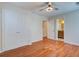 This bedroom features hardwood floors, ceiling fan, and a closet with double doors for ample storage at 3627 Marginal Rd, Mount Pleasant, SC 29466