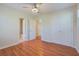 This bedroom features hardwood floors, ceiling fan, closet with double doors, and access to a bathroom at 3627 Marginal Rd, Mount Pleasant, SC 29466