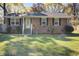 Well maintained brick home with a green lawn, black shutters, and inviting front entrance in a desirable neighborhood at 3627 Marginal Rd, Mount Pleasant, SC 29466
