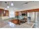 Updated kitchen with stainless steel appliances, granite counters, wood cabinets, and stylish backsplash for modern appeal at 3627 Marginal Rd, Mount Pleasant, SC 29466