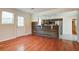 Inviting living room with hardwood floors, large windows, offering a seamless flow to the adjacent, modern kitchen area at 3627 Marginal Rd, Mount Pleasant, SC 29466