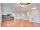 Spacious living room featuring hardwood floors, recessed lighting, ceiling fan and seamless transition to the open kitchen at 3627 Marginal Rd, Mount Pleasant, SC 29466