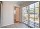 Bright sunroom with tile floor and sliding doors to a wooden deck at 3627 Marginal Rd, Mount Pleasant, SC 29466