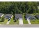 Suburban homes pictured from above showcasing lush greenery and neighborhood street layout at 3806 Sourwood Ct, Ladson, SC 29456