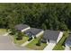 Aerial view of a residential area featuring neatly arranged homes with driveways and trees at 3806 Sourwood Ct, Ladson, SC 29456