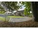 Relaxing backyard hammock hanging in a lush green space near the back of the house at 3806 Sourwood Ct, Ladson, SC 29456