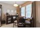 Cozy breakfast nook with a dark wood table, comfortable seating, and lots of natural light from nearby windows at 3806 Sourwood Ct, Ladson, SC 29456