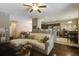 Cozy living room with a comfortable sectional sofa, open layout, and modern decor at 3806 Sourwood Ct, Ladson, SC 29456