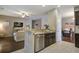 Open-concept living space featuring stainless appliances, modern finishes, and lots of natural light at 3806 Sourwood Ct, Ladson, SC 29456