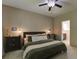 Main bedroom with dark furniture, natural light, and en suite bathroom at 3806 Sourwood Ct, Ladson, SC 29456