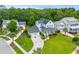 Aerial view of a beautiful home with a lush green lawn and well-manicured landscaping in a quiet neighborhood at 3870 Fifle St, Mount Pleasant, SC 29466