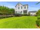 Large backyard with green lawn and trampoline next to the house at 3870 Fifle St, Mount Pleasant, SC 29466