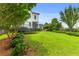 Spacious backyard with lush green lawn and trampoline, perfect for Gathering fun and entertainment at 3870 Fifle St, Mount Pleasant, SC 29466