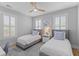 Serene bedroom featuring two twin beds, soothing colors, and ample natural light, ideal for relaxation and rest at 3870 Fifle St, Mount Pleasant, SC 29466