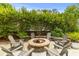Cozy stone fire pit area with ample seating, perfect for outdoor gatherings and relaxation at 3870 Fifle St, Mount Pleasant, SC 29466