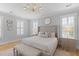 This bedroom features a neutral color palette and offers a chandelier, accent mirror and a bench at 3870 Fifle St, Mount Pleasant, SC 29466