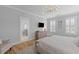 This bedroom features a wall-mounted TV and an adjoining bathroom with a vanity at 3870 Fifle St, Mount Pleasant, SC 29466