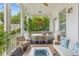 Inviting covered porch with outdoor seating, dining table, and cozy fireplace feature at 3870 Fifle St, Mount Pleasant, SC 29466