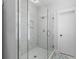 This tile shower features a glass enclosure and a white door at 3870 Fifle St, Mount Pleasant, SC 29466