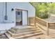 The back of this home has a newly constructed deck with a sliding glass door at 4756 Churchill Rd, North Charleston, SC 29405