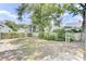 A large and open backyard with green trees around its perimeter at 4756 Churchill Rd, North Charleston, SC 29405