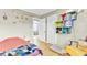Bright bedroom with hardwood floors, comfortable bed, and quirky decorations at 4756 Churchill Rd, North Charleston, SC 29405