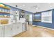 Bright kitchen featuring custom cabinets, stainless appliances, quartz countertops, and light-filled dining area at 4756 Churchill Rd, North Charleston, SC 29405