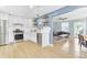 Bright living room with an open kitchen, stainless steel appliances, and a breakfast bar at 4756 Churchill Rd, North Charleston, SC 29405