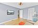 Cozy living room featuring hardwood floors, TV, and a comfortable couch at 4756 Churchill Rd, North Charleston, SC 29405