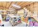 A workshop with wooden walls and ceilings, multiple shelves, a workbench, and storage at 4756 Churchill Rd, North Charleston, SC 29405