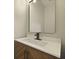 Modern bathroom vanity with a sleek sink, quartz countertop, and dark fixtures under a large mirror at 4949 Serene Ln, Hollywood, SC 29449