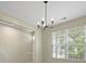 Dining area with natural light through window and modern light fixture at 4949 Serene Ln, Hollywood, SC 29449