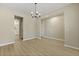 Bright dining room features modern chandelier and neutral tones at 4949 Serene Ln, Hollywood, SC 29449