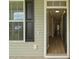 Inviting foyer showcasing hardwood floors and a clear view into the home's interior at 4949 Serene Ln, Hollywood, SC 29449