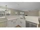 Kitchen includes stainless steel dishwasher, faucet, and island with quartz countertops at 4949 Serene Ln, Hollywood, SC 29449