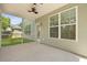 Screened porch with view of backyard, exterior of house with windows and door at 4949 Serene Ln, Hollywood, SC 29449
