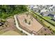 Aerial view of a fenced dog park with walking path and young trees at 5305 Bending Flats Way, Summerville, SC 29485