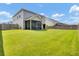 Expansive, well-maintained backyard with privacy fence, screened-in porch, and open lawn area at 613 Ravens Wood Rd, Summerville, SC 29486