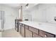 Bright bathroom with double sink vanity, soaking tub, and glass-enclosed shower at 613 Ravens Wood Rd, Summerville, SC 29486