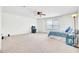 Spacious bedroom with ceiling fan, carpeted floor, providing a versatile and comfortable living space at 613 Ravens Wood Rd, Summerville, SC 29486
