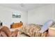 Bright bedroom features comfortable bed, wooden dresser, and mounted television at 613 Ravens Wood Rd, Summerville, SC 29486