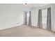 Bedroom with two windows with curtains and beige carpet at 613 Ravens Wood Rd, Summerville, SC 29486