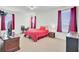 Bedroom featuring a cozy bed, a desk, and natural light from the windows at 613 Ravens Wood Rd, Summerville, SC 29486