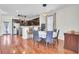 Open dining area with hardwood floors, modern lighting, and bar stool seating at 613 Ravens Wood Rd, Summerville, SC 29486