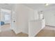Bright hallway with neutral carpet, white walls, and doorways leading to other rooms at 613 Ravens Wood Rd, Summerville, SC 29486